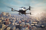 Image of Advanced Air Mobility aircraft flying over a city